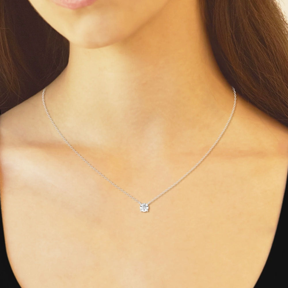 Front view of Puro Round Floating Diamond Pendant with white gold chain on model.